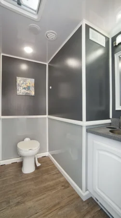 Toilet and sink inside 2 Station Restroom Trailer