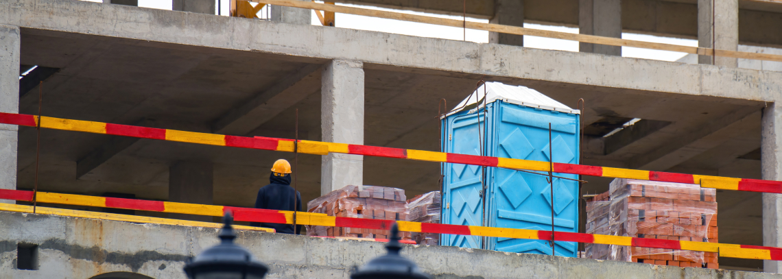 Rooftop porta potty that is used for construction sites on high structures.
